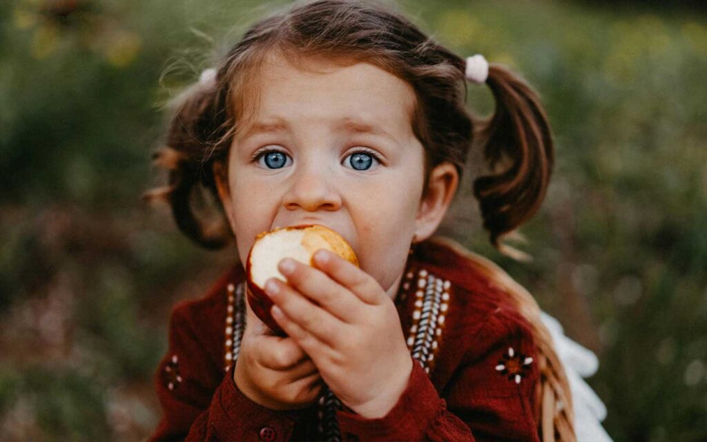 Little-Girl-Eating-Apple